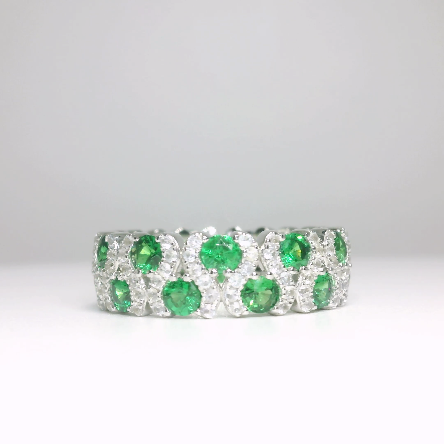 Tsavorite and white sapphire eternity ring