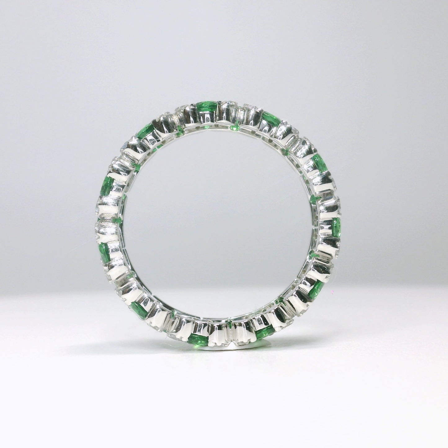Tsavorite and white sapphire eternity ring